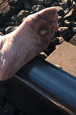 One Shoe Stroll On The Train Tracks